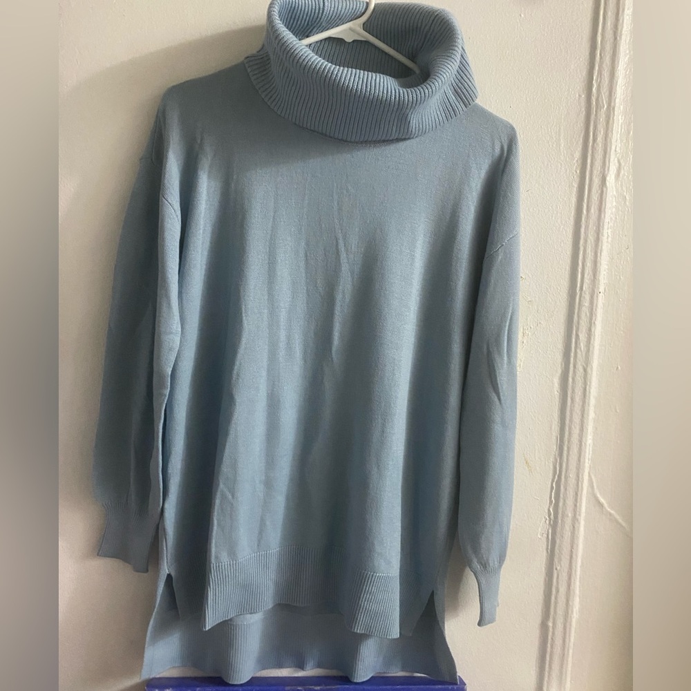 Women’s light blue turtleneck sweater. Size M. Brand new condition- never worn.